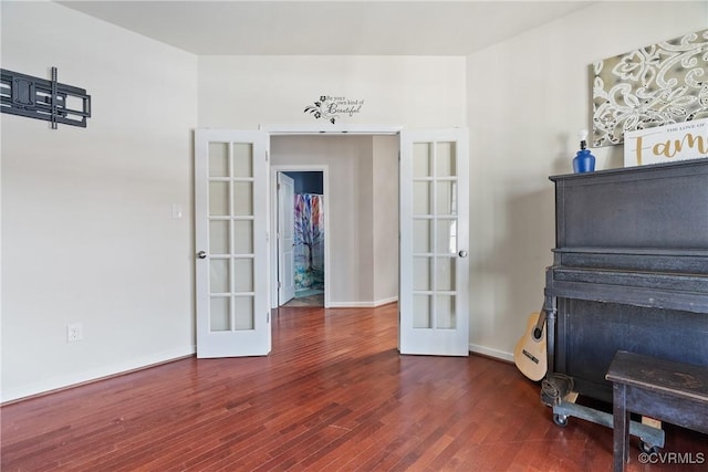 miscellaneous room featuring french doors and dark hardwood / wood-style floors