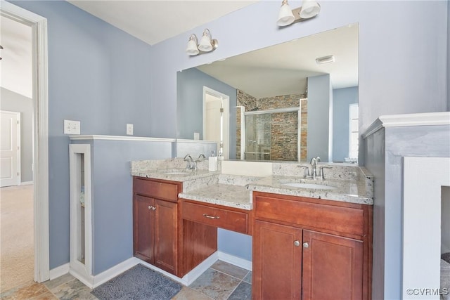 full bathroom with double vanity, a shower stall, visible vents, and a sink