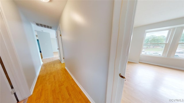 hall with light wood-type flooring