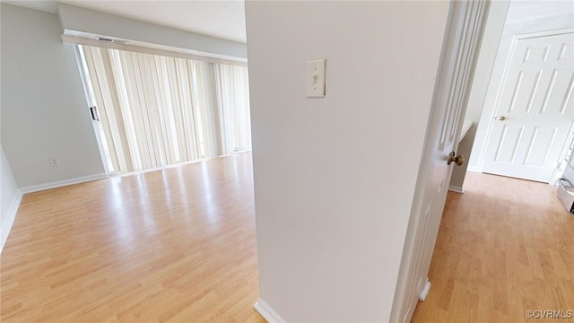 corridor featuring light hardwood / wood-style flooring