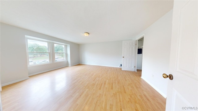 spare room featuring light hardwood / wood-style floors