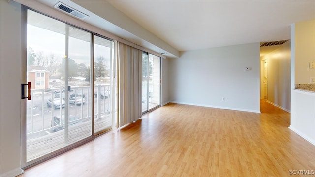 spare room featuring light wood-type flooring