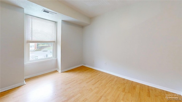 empty room with light hardwood / wood-style floors