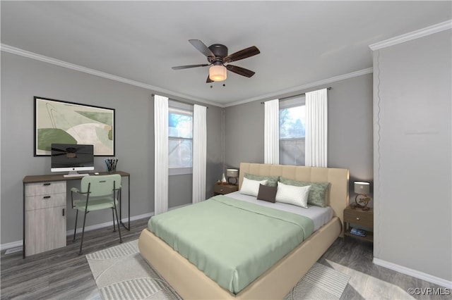 bedroom featuring multiple windows, ceiling fan, dark hardwood / wood-style floors, and ornamental molding