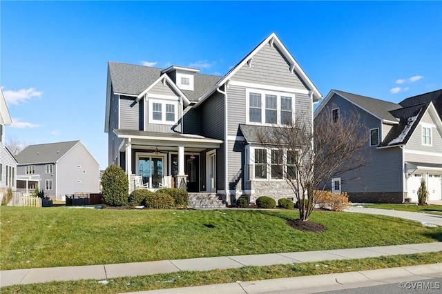 view of front of home with a front yard and covered porch