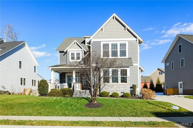 front of property featuring a porch and a front yard