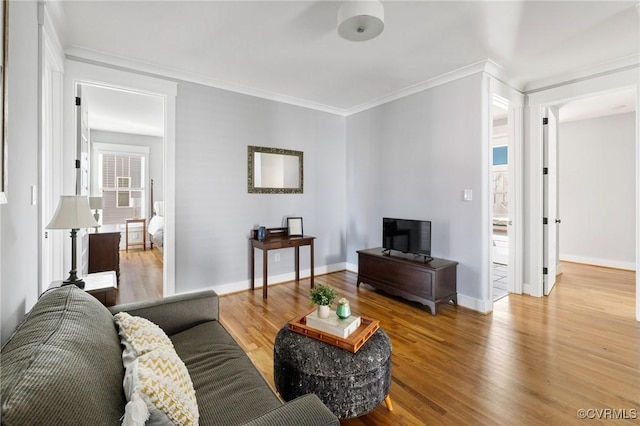 living room featuring crown molding and hardwood / wood-style floors