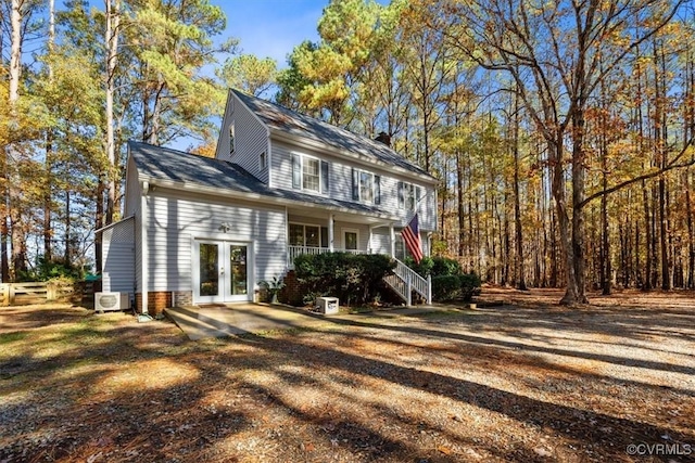 view of front facade with french doors and a porch