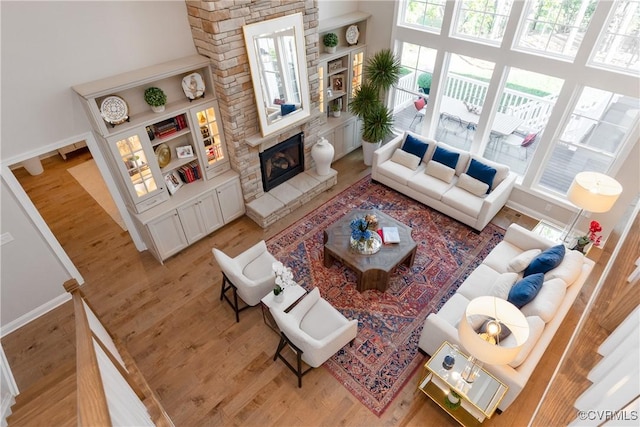 11163 Independence Rd, Ashland, VA 23005 - living room with a fireplace, a high ceiling, and hardwood / wood-style flooring