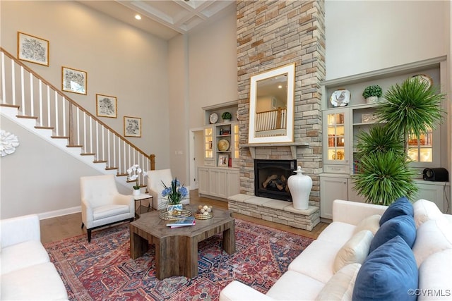 11163 Independence Rd, Ashland, VA 23005 - living room with built in shelves, a stone fireplace, and a high ceiling
