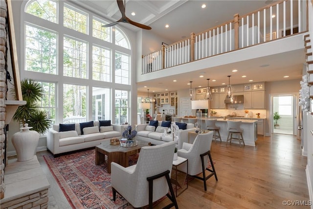 11163 Independence Rd, Ashland, VA 23005 - living room with coffered ceiling, ceiling fan, a towering ceiling, beamed ceiling, and light hardwood / wood-style floors