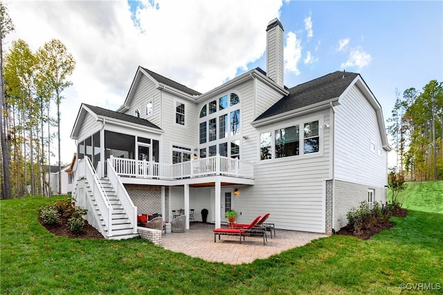 11163 Independence Rd, Ashland, VA 23005 - back of house featuring a lawn, a sunroom, and a patio