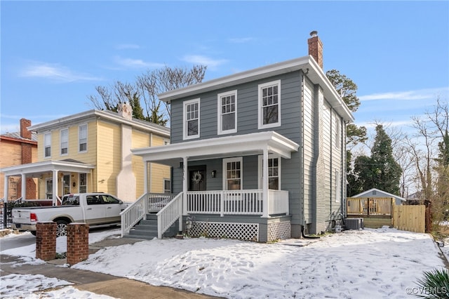 front of property featuring cooling unit and a porch