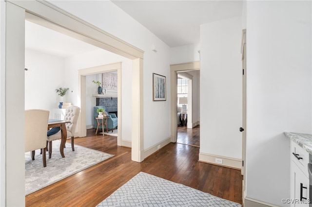 hall with dark hardwood / wood-style floors