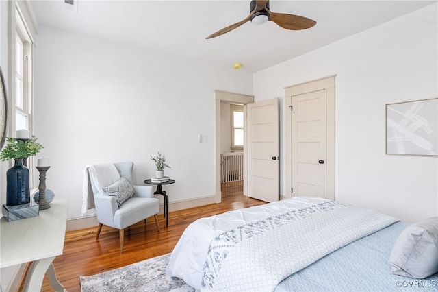 bedroom featuring hardwood / wood-style flooring and ceiling fan