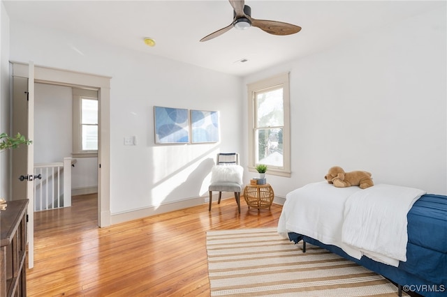 bedroom with ceiling fan and light hardwood / wood-style floors