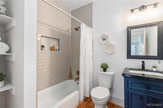 full bathroom with hardwood / wood-style floors, vanity, toilet, and shower / tub combo with curtain