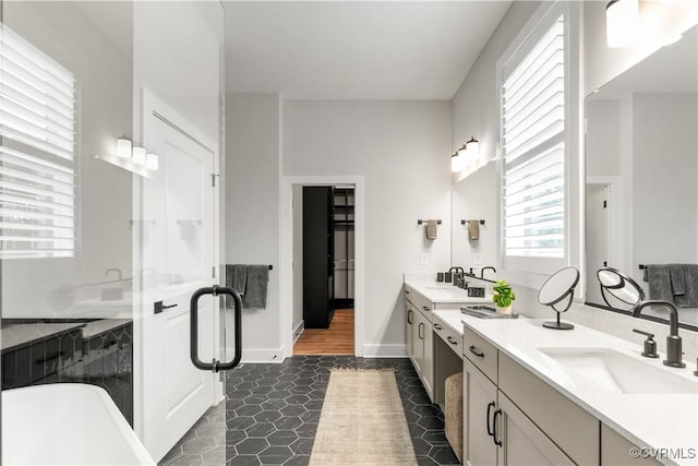 bathroom featuring separate shower and tub, tile patterned flooring, and vanity