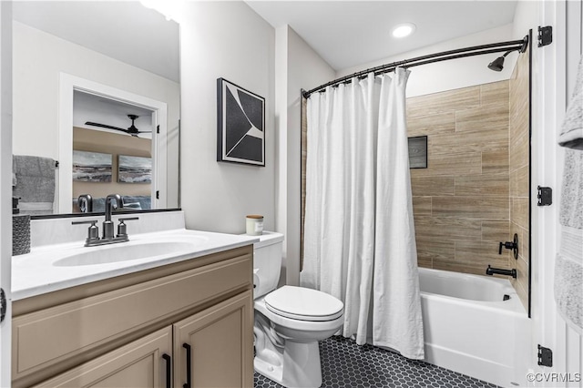 full bathroom featuring vanity, shower / bath combo, and toilet