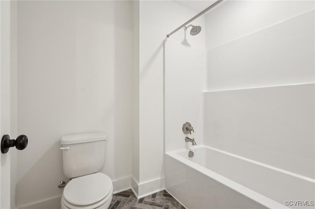 bathroom featuring toilet and  shower combination