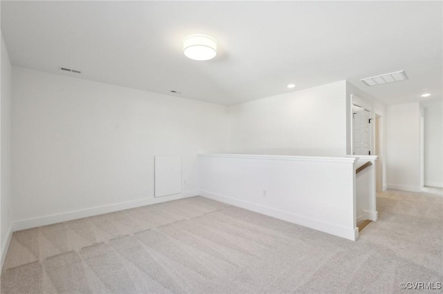 spare room with light colored carpet