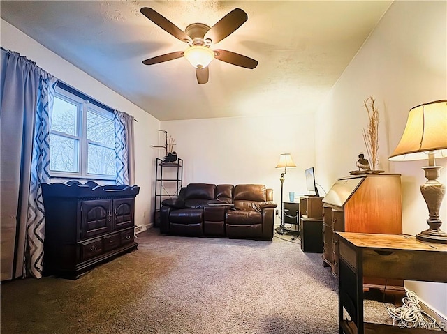 sitting room featuring ceiling fan and carpet floors