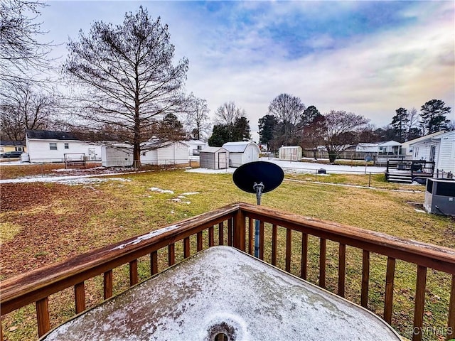 wooden deck with a yard