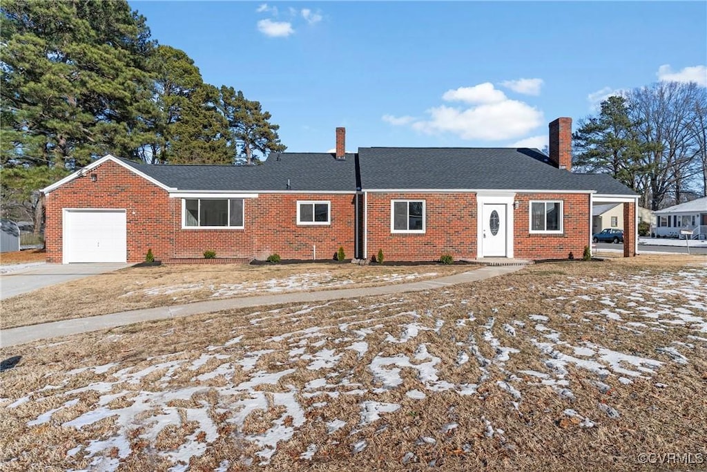 single story home featuring a garage