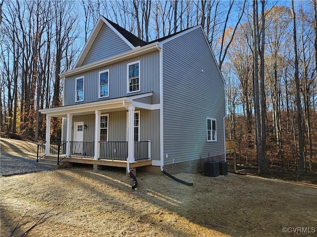 view of front of house with central AC unit and a porch