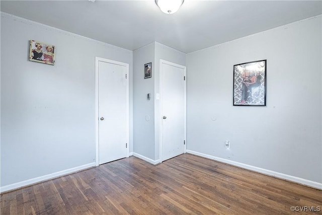 empty room featuring dark wood-type flooring