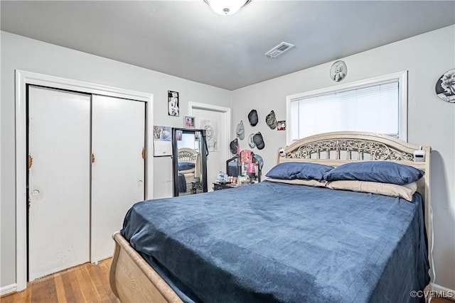 bedroom featuring a closet and wood-type flooring