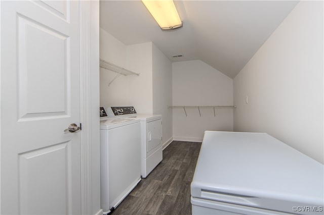 laundry room with dark wood-style floors, laundry area, washing machine and clothes dryer, and visible vents