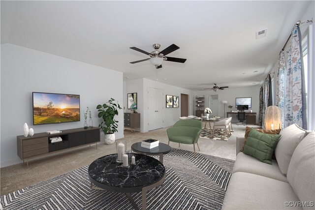 living area with a ceiling fan, carpet, visible vents, and baseboards