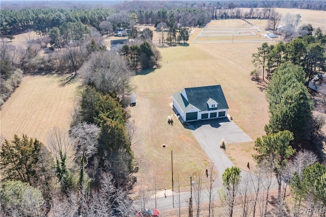 birds eye view of property with a rural view