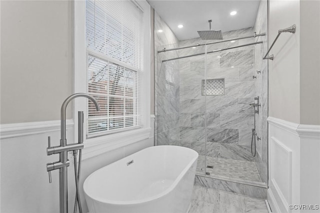 bathroom with separate shower and tub