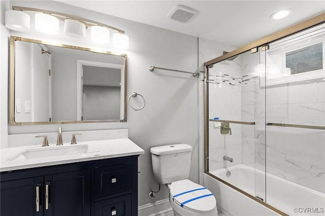 full bathroom featuring combined bath / shower with glass door, vanity, and toilet