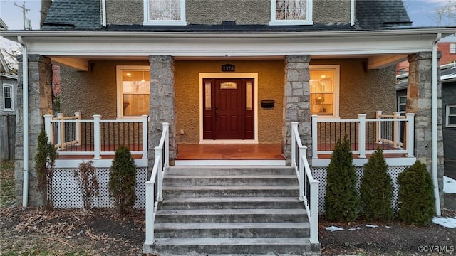 entrance to property with a porch