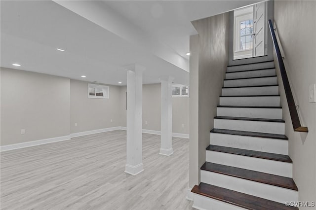 staircase with wood-type flooring