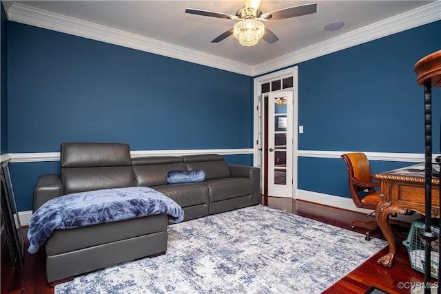 living room with hardwood / wood-style flooring and crown molding