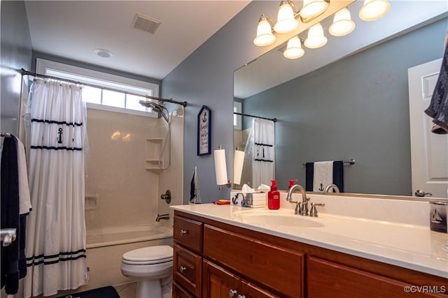 full bathroom with toilet, vanity, and shower / bath combo with shower curtain