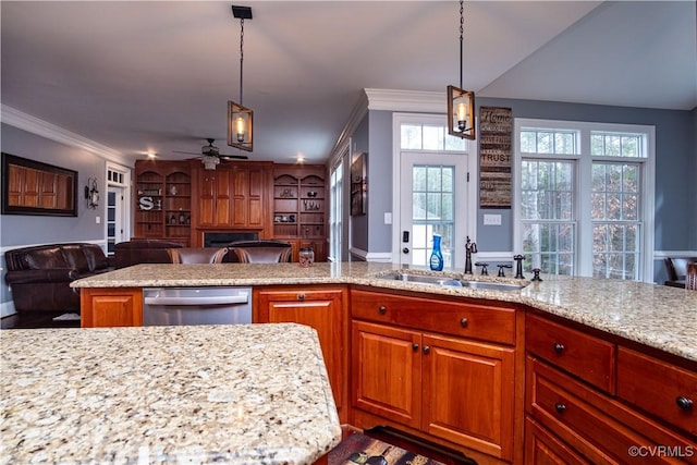 kitchen with sink, ceiling fan, dishwasher, and pendant lighting