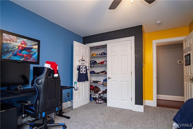 carpeted office with ceiling fan