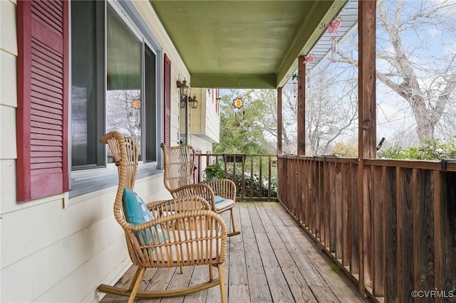 balcony featuring a sunroom and covered porch