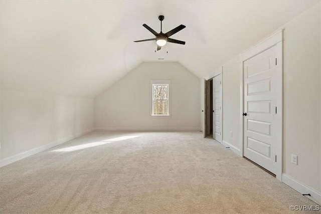 bonus room with ceiling fan, light colored carpet, and lofted ceiling