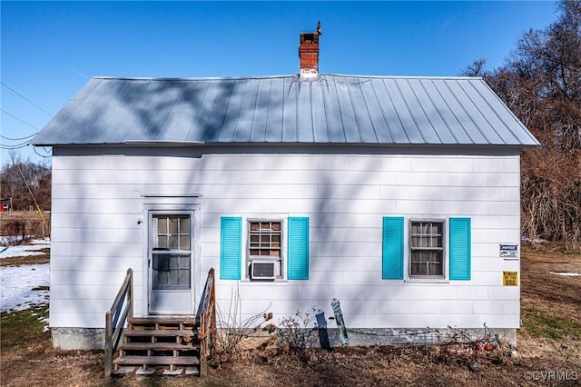 rear view of property featuring cooling unit