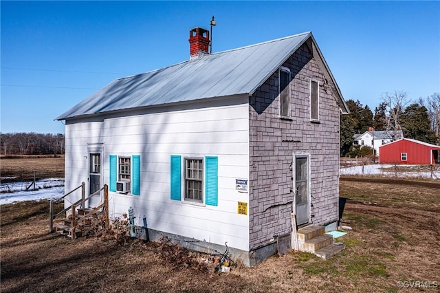 view of side of property with cooling unit