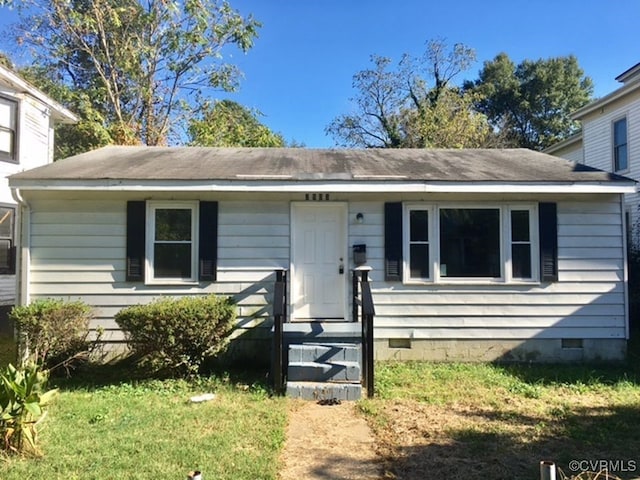 view of front of home with a front yard