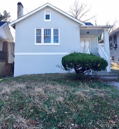 view of property exterior with a lawn