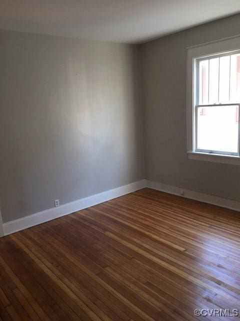 empty room featuring wood-type flooring