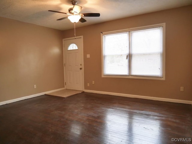 entrance foyer with ceiling fan and dark hardwood / wood-style flooring